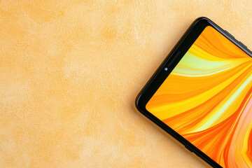 Poster - sleek black smartphone with vibrant glowing screen on textured background. bright colors create engaging visual experience, perfect for showcasing modern technology