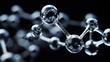 A close-up of a glass molecule model on a black background.