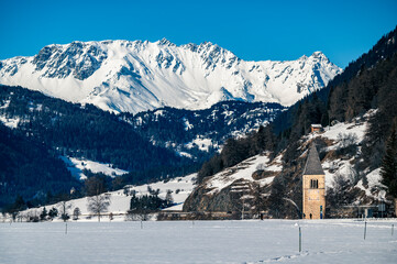 Wall Mural - Resia Lake. Curon. The wonder of the Venosta Valley in winter.