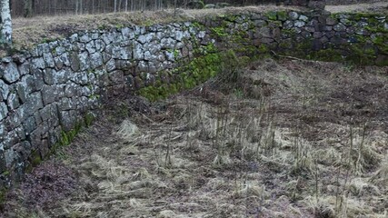 Poster - Old moat with stone walls of cobblestones.