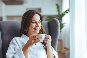 Wall Mural - Relaxed Woman in Bathrobe Enjoying Morning Coffee at Home