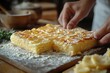 © Atiq Fuad - A freshly baked apple pie, with a flaky crust and a golden-brown top, is cut into squares and ready to be served.