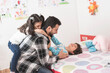 © Antonio Recena - Father with Beard Playing in Bedroom with Son and Daughter While Getting Them Ready for School
