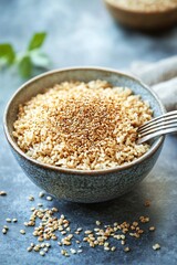 Wall Mural - A bowl of cooked grains topped with sesame seeds, showcasing a healthy meal option.