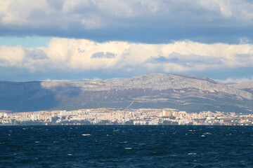 Wall Mural - Contemporary buildings, gardens and beaches at the waterfront in Split, Croatia. View of Split from the boat.