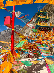 Wall Mural - Views of Tibetan monastery, village, houses, green field and mountains along the road from Shangri La to Yading, Sichuan 