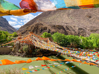 Wall Mural - Views of Tibetan monastery, village, houses, green field and mountains along the road from Shangri La to Yading, Sichuan 