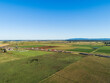 © Austockphoto - Aerial view of beginnings of bypass highway road under construction in farmland