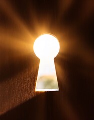 Poster - Golden light shining through keyhole creates dramatic effect