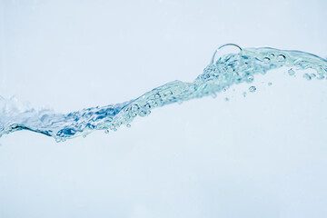 Wall Mural - Water splash isolated on white background, Air Bubbles Float Up Under Blue Water. Pure Water Wave, Oxygen Relaxation. Blue bubbles Water Textured.