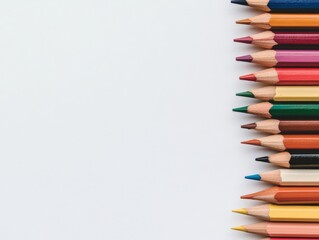 Poster - Brightly colored pencils are organized in a neat stack, showcasing sharp points in a gradient against a pale blue surface, leaving space for text or graphics