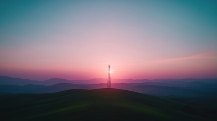Fototapete - A vibrant sunset illuminates a communication tower silhouetted against the colorful sky, with rolling hills creating a striking backdrop and ample copy space