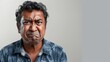 © Z A C - The image depicts a man with a scowling expression featuring a furrowed brow and pursed lips.