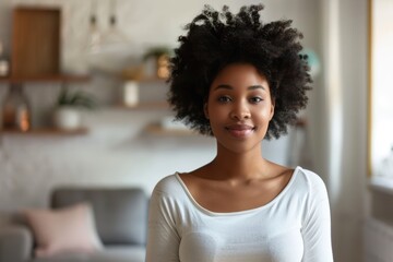 Sticker - Portrait of a satisfied afro-american woman in her 20s sporting a long-sleeved thermal undershirt over modern minimalist interior