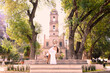 © Luis Fernando Dávila - A couple having a romantic kiss in front of the San Miguel parish church in Temascalcingo, a Mexican village among the trees