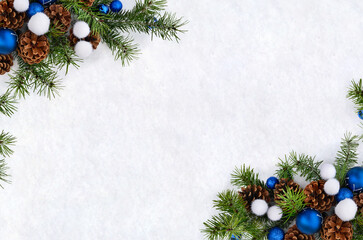 Wall Mural - christmas decoration. blue christmas balls, cones pine, branches christmas tree on snow with space f