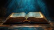 © Thoa - holy bible open book on wooden table in dark room with rays of light