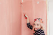 © Melika Tursic/Stocksy - Woman painting wall at home