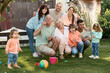 © Iuliia Versta/Stocksy - Portrait of large family playing on a backyard