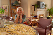 © tessy morelli/Stocksy - Happy senior woman smiling over table with homemade pasta
