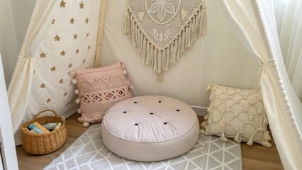 Poster - The nook showcases a plush floor cushion in the center emphasized by a backdrop of intricately stitched fabrics and a beautifully crafted macrame wall hanging.