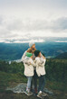 © Tanya Yatsenko/Stocksy - Mother with daughters on the mountain in Norway