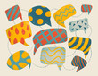 © Marusya Wrobel/Stocksy - Colorful speech bubbles with various patterns on a light background