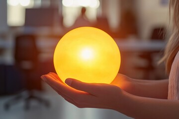 Poster - A person holds a glowing sphere in their hand, perfect for depicting magical or spiritual moments