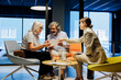 © BONNINSTUDIO/Stocksy - Financial advisor giving investment advice to senior couple in office