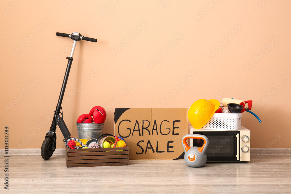 Unwanted stuff for garage sale near beige wall
