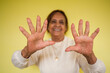 © J Esteban Berrío/Stocksy - Hands of an senior woman in a studio portrait