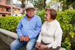 © J Esteban Berrío/Stocksy - Senior couple sitting on a bench
