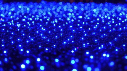 Poster - Blue Bokeh Lights on a Dark Background Creating a Magical Atmosphere