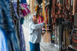 © Dani Nahuel/Stocksy - Artisan Woman Opening Her Small Business Store