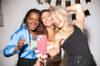 © Malquerida Studio/Stocksy - Women friends taking a selfie in new year party