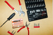 © Colour Laboratory/Stocksy - Building tools pliers tongs nuts screws screwdrivers on working desk