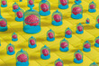 © Marcos Osorio/Stocksy - A collection of caged brains on vibrant yellow surface