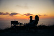 © Santi Nuñez/Stocksy - Mother and child watching sunset by the sea