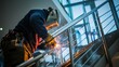 © aubriella - A welder welding stainless steel handrails for a luxury residential building, Handrail welding scene, Architectural detailing style