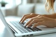 © Vadym - Closeup female hands type on modern laptop. Manicured nails. Remote work concept. Modern office setting. Digital communication. Tech focus. Business woman. Hands close-up. Home office. Online work.