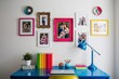 © Michael - Vibrant Photo Frame Decor on White Wall Over Colorful Desk Setup