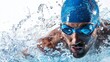 © Wannaeka - Close-up of a determined swimmer in blue cap and goggles powering through water, white background emphasizing motion and energy