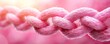 © Anurak - Colorful pink rope braided together in soft lighting abstract photography indoor setting close-up view for artistic inspiration