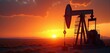 © Makaron - Captivating silhouette of an oil pump jack at sunset, symbolizing the energy industry and fossil fuel extraction. Ideal for environmental, energy, and business themes.