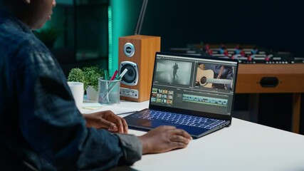 Poster - video editor analyzing film montage on laptop screen before editing color grading and lighting in cr