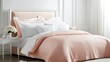 © Atthapon - A bed with a white headboard and pink sheets