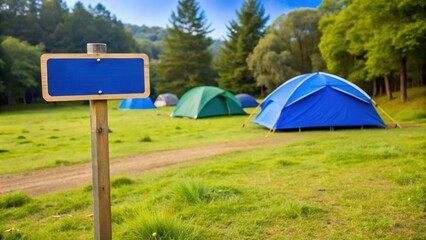 Wall Mural - Camping field with blue tent sign post in front, camping, outdoors, nature, wilderness, adventure, travel, tent, blue, field