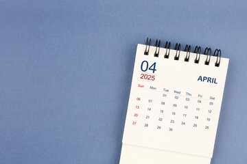 Wall Mural - April 2025 Mini monthly desk calendar for 2025 year on blue color background.