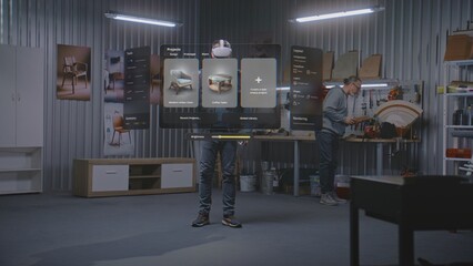 Fototapete - Modern workshop: Professional artisan or designer wearing VR headset assembles chair using extended reality and app with AI user interface. 3D graphics of holographic virtual furniture. VFX animation.