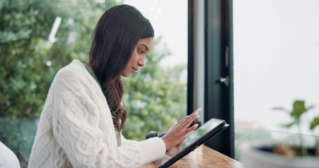 Wall Mural - Woman, home office and tablet with research, serious and concentration for typing or online. Female person, texting and scroll on technology as communication, email and internet for social networking